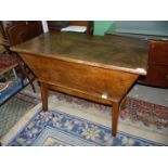 A lovely old mixed hardwoods Dough Bin table, the top covering the storage void,