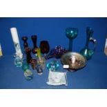 A quantity of coloured glass including green ewer vases, red brandy balloon, bud vases,