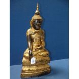 A large Burmese Ava style carved wood figure of Buddha, lacquered and gilded,
