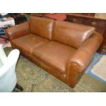 A brown hide upholstered three seater Settee, by Thomas Lloyd,