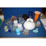 A quantity of glass including; light shades, orange and blue vases, brandy balloon vases,