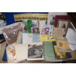 A box of ephemera including , Sothebys catalogues, 'The Great Musicians' vinyls, ariel photographs,