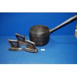 A cast iron saucepan by CWS of Dudley (No 8 10 pints), plus three flat irons.