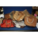 A box of wicker bags, cutlery tray and basket.