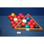 A set of snooker balls and triangle.