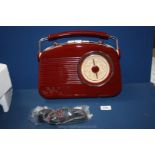 A boxed Coopers of Stratford retro radio, burgundy colour with cream buttons.