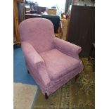 An elegant fireside Armchair having puce coloured loose cover.