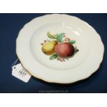 A Meissen dessert plate, painted with still life of fruit, mid 19th Century, crossed swords mark.