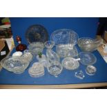 A quantity of pressed glass bowls, candle holders, etc.