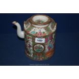 A highly decorated Canton Teapot having butterflies and bird decoration and oriental figures.