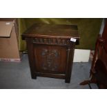 An old Charm/Priory Oak type Chest/locker with hinged lid & carved details to the single front