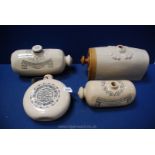 Four stoneware hot water Bottles including Doulton and Fulham Pottery, some cracks and damage.