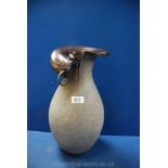 A large modern vase with split top detail and baluster shape body in granite style finish,