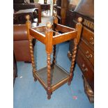 A square 1940's/1950's Umbrella/stick stand having twist uprights, complete with metal drip tray,