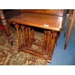 A nest of three Oak occasional Tables standing on turned legs,