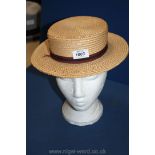 A boater Hat with red and black ribbon, 5 3/4".