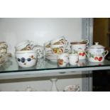 A quantity of Royal Worcester 'Evesham' cups, saucers, egg cups, 'Wild Strawberry' conserve pot etc.