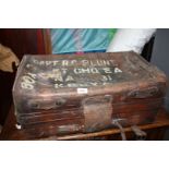 A much travelled heavy leather Trunk, the lid painted 'CAPT. R.C.