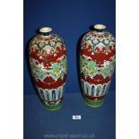 A pair of Edwardian vases; with cracks and repairs. 15 1/2" tall.