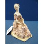 A fine and attractively painted art deco pottery figure of a lady of fashion; Italian or German,