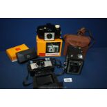 A boxed Brownie Six-20 camera model E with flash contents in a case,