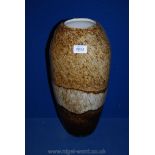 A contemporary large glass Vase having various shades of brown and cream with rounded rim and inner