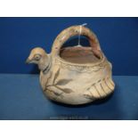 An interesting North African pottery vessel in the form of a bird with painted details,