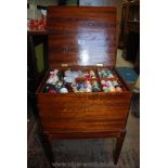 A Mahogany work table/sewing Box having hinged lid revealing a lift-out tray containing numerous