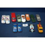 Twelve small Matchbox vehicles including rescue, BMW team, Shell racing car, etc.