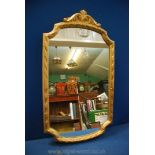 A ''Clark Eaton'' gilded framed shaped Wall hanging Mirror,