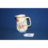 A small floral Dresden Jug with gilt decoration and ridged handle,