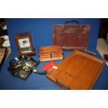 A papier mache crumb Tray and brush, a leather music bag, two handled wooden tray,