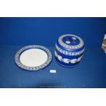 A dark blue Wedgwood Jasperware cheese Dome and stand, crack to the dome and chips to plate.