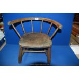 A solid Elm seated low backed child's Armchair standing on turned legs, 18 3/8" x 16" high.