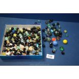 A quantity of marbles including black, blue, clear, green and multi-coloured etc.