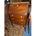 A Mahogany Bureau having light and darkwood stringing,