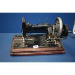 A vintage German hand sewing machine, 'S. Loewe'.