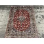 A large woolen hand-made Kashan Carpet signed at top '' Kashan Fatali' within old Persian Flag,