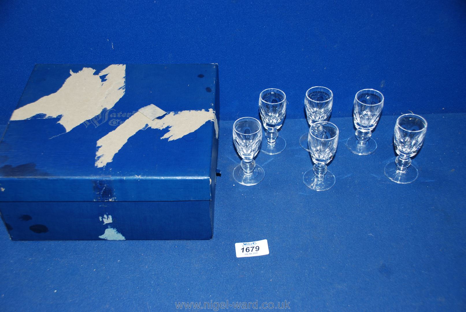 A boxed set of six Waterford crystal liqueur glasses.