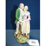 An early 19th Century Staffordshire pearlware group of a courting couple,
