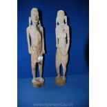 A pair of African carved figures of lady and gent,