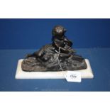A small cast figure of a child, on marble base. 10 1/2" x 7".