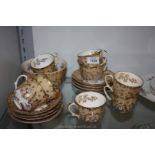 A Victorian/ Edwardian part Teaset in cream with gold detail, some hairline cracks.