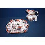 An Amherst Japan Minton bone china jug and plate, white with orange, blue and gold decoration.
