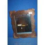 An old wooden frame mirror with leaf decoration to corners. 14" x 11" tall, chips to two corners.