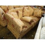 A gold and maroon upholstered Knoll type three seater Settee having tasselled rope adjustable ends