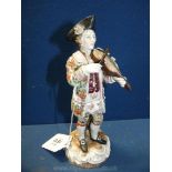 A finely detailed 'Old Volkstedt' portrait figure of a violinist in late 18th Century attire,