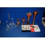 A quantity of coloured and clear glass including Carnival vases, bells, Galileo thermometer,
