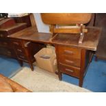 A double pedestal military style Desk with six short drawers and frieze drawer (damaged),