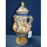 A good Spanish pottery four handled vase and cover painted with animals and huntsmen.